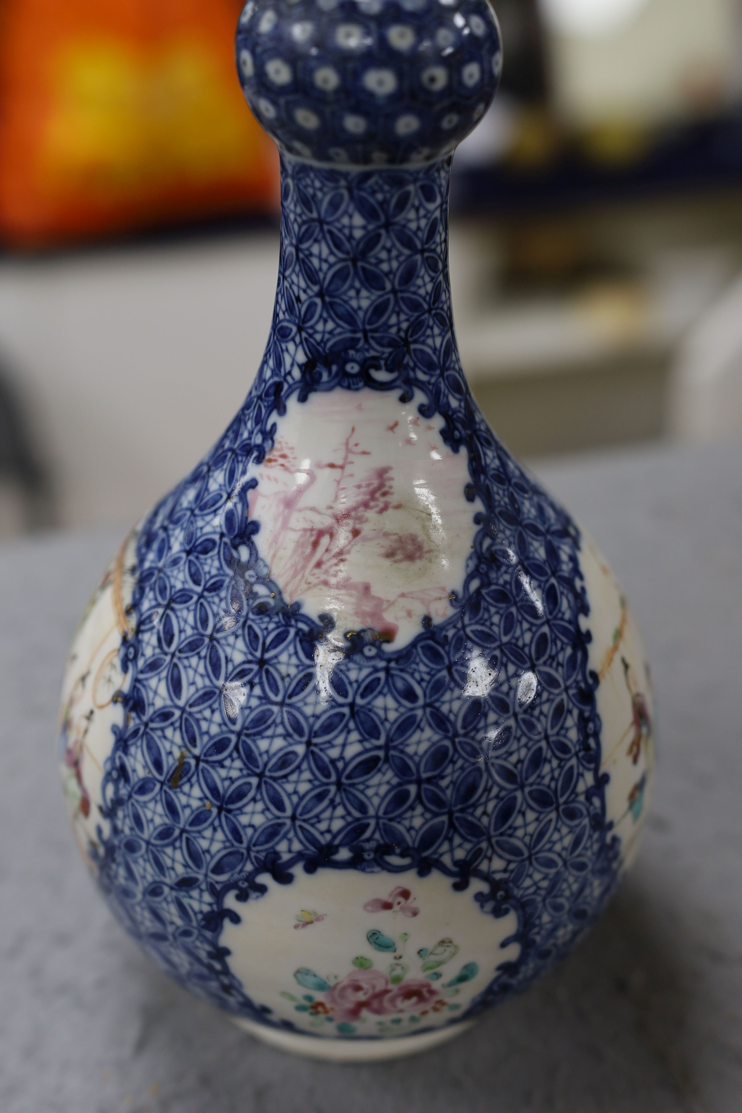 A pair Samson of Paris vases in the Chinese famille verte style and a Chinese Qianlong famille rose garlic neck vase with blue panelling motif, tallest 26cm